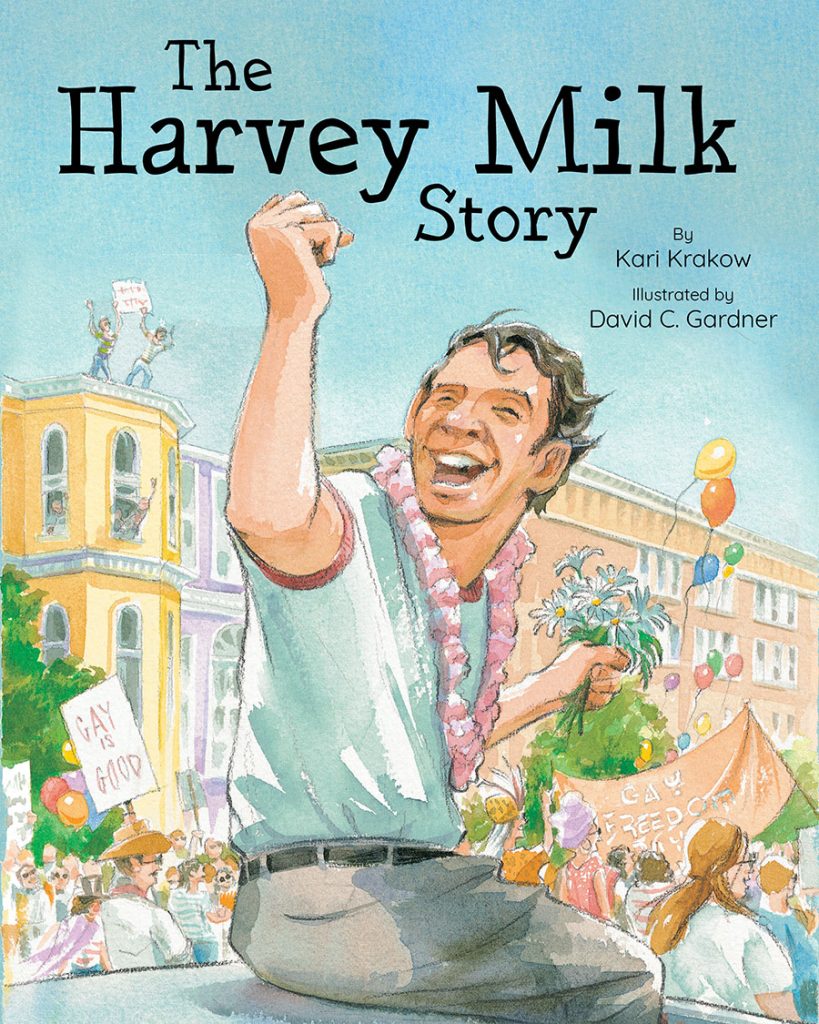 Cover of The Harvey Milk Story, showing Harvey Milk cheering with his fist in the air. Crowds of folks with posters, banners, and balloons surround him in the background.