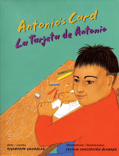 Cover of Antonio's Card, showing a young brown boy at a desk, drawing with crayons on a white piece of paper.