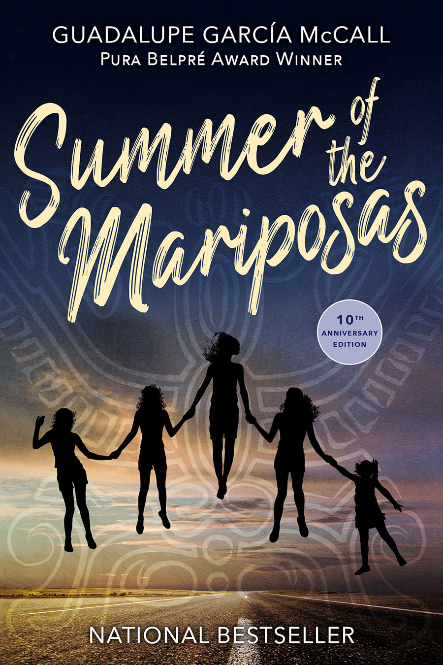 Summer of the Mariposas cover showing the silhouettes of five sisters holding hands and floating above the road with a butterfly outline drawn behind them